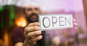 Small business owner opening his store for the day