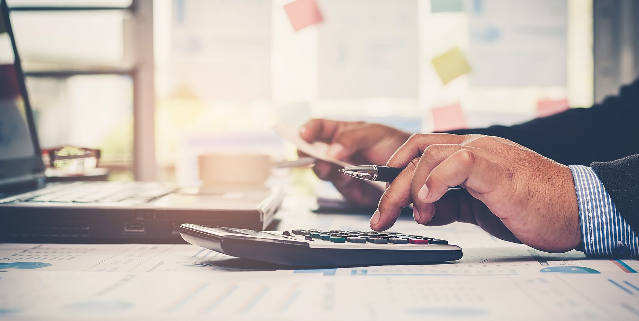 Closeup of business person analyzing financial data